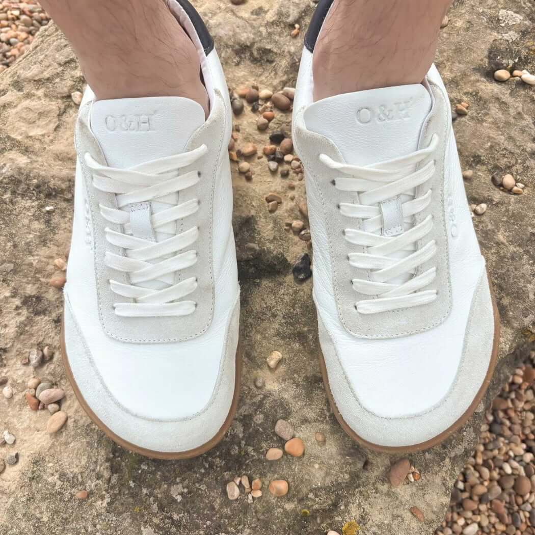 model wearing aspen barefoot trainers in white top down view showing toe shape