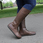 model standing outdoors in beech 18 brown boots wearing them with jeans