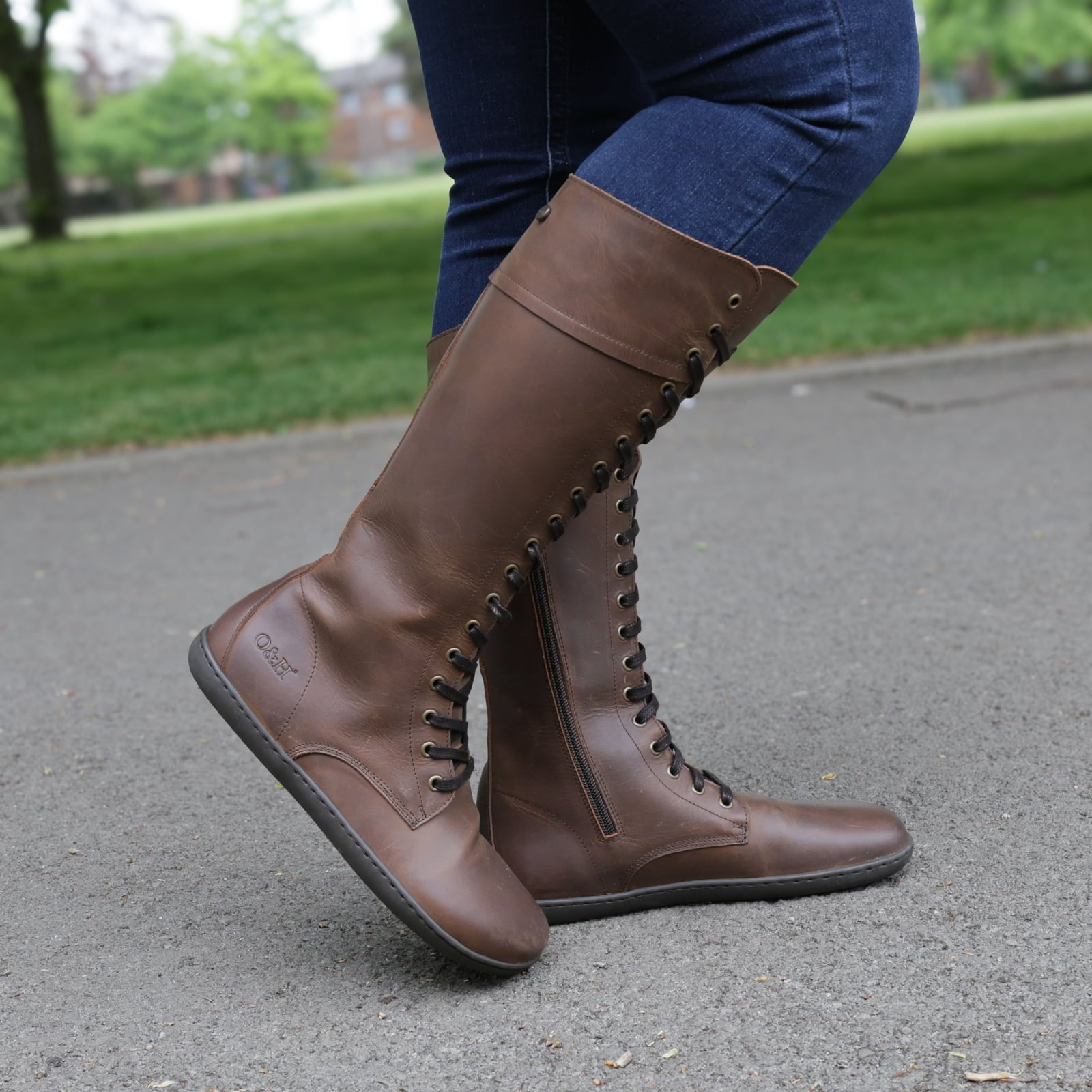 model standing outdoors in beech 18 brown boots wearing them with jeans