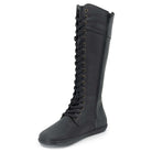 black barefoot boots showing inside zip and front lace on white background