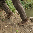 model walking in woodland wearing mens blackthorn barefoot walking boots in brown