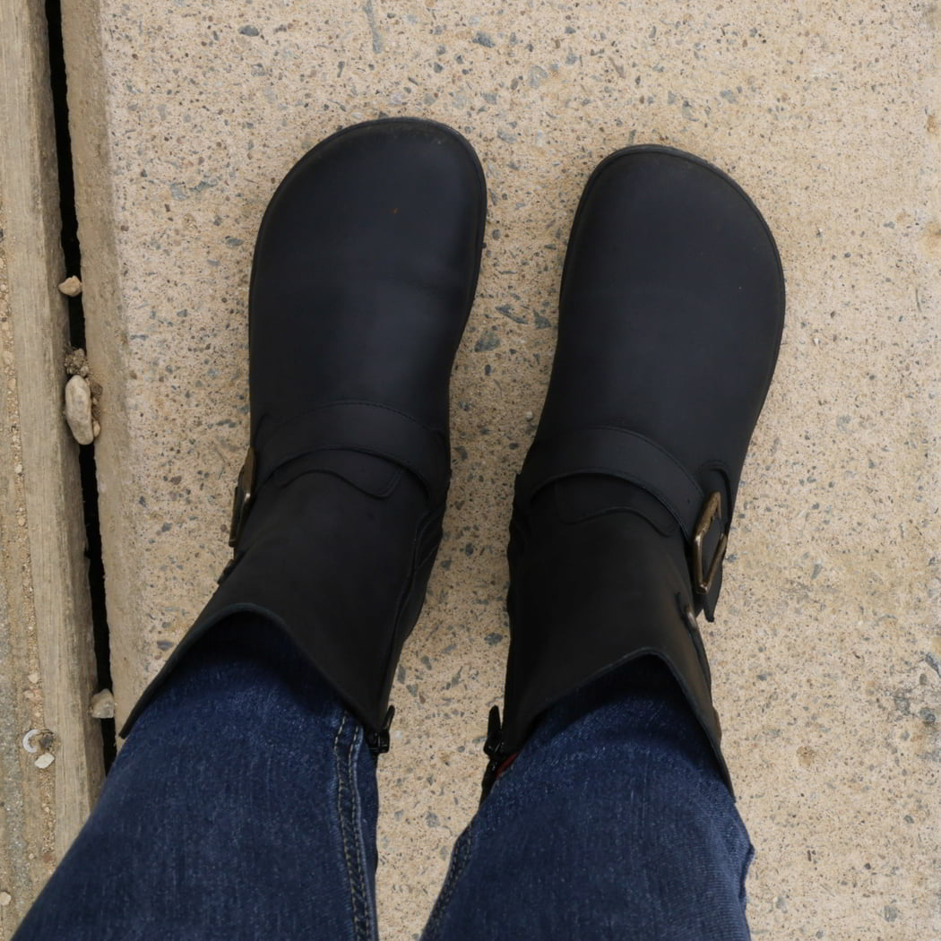 top down view of cedar demi barefoot boots in black showing the toe shape