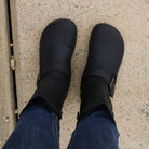 top down view of cedar demi barefoot boots in black showing the toe shape