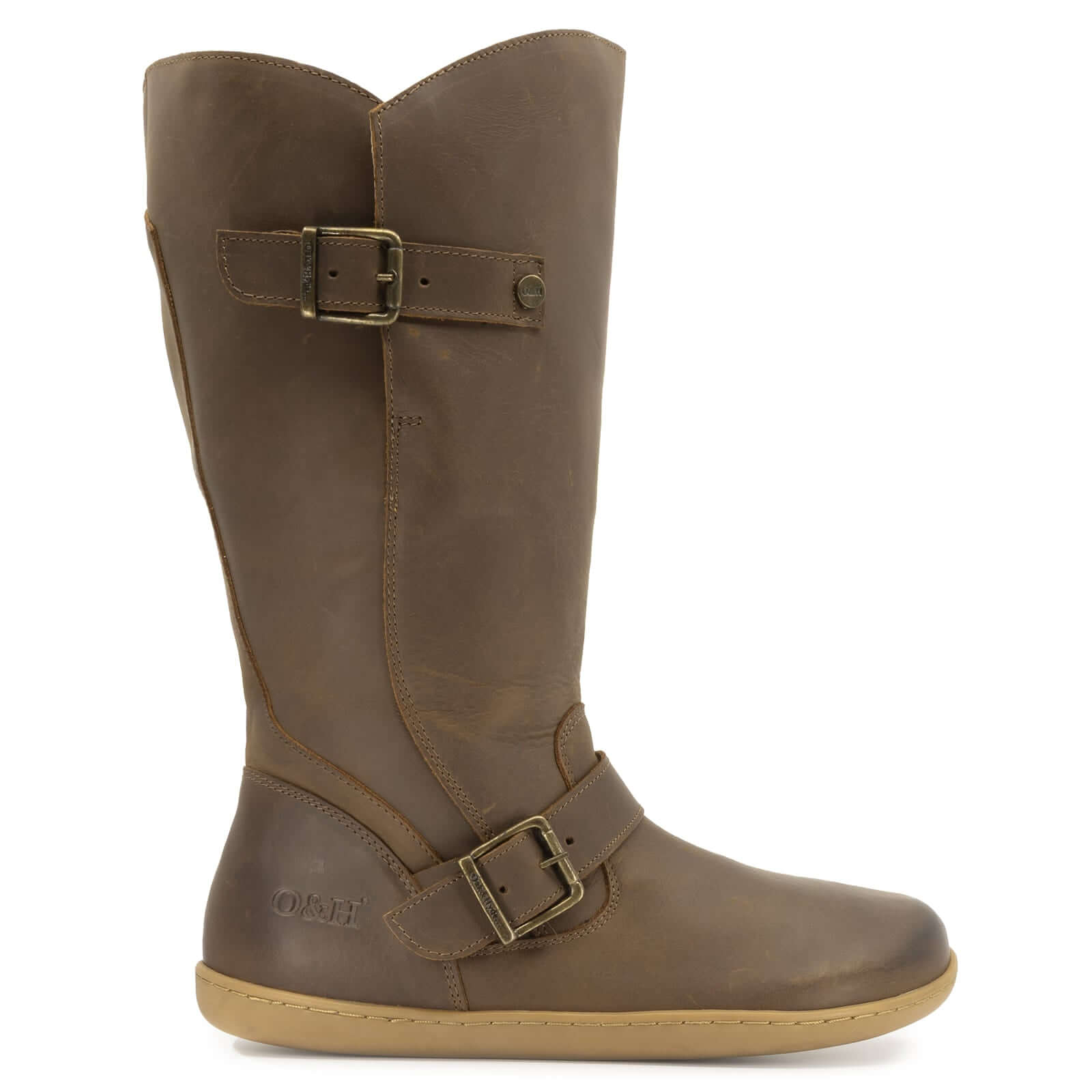 side profile view of cedar wide calf barefoot boots in brown showing buckle detailing