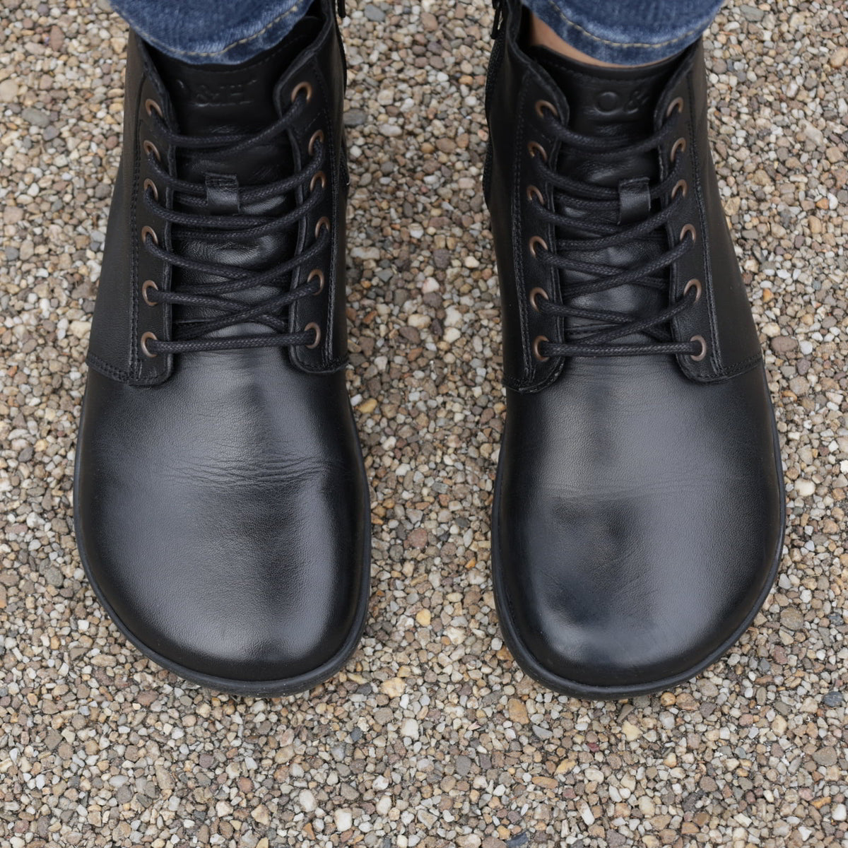 top down view of womens cherry barefoot boots in black showing the natural toe shape