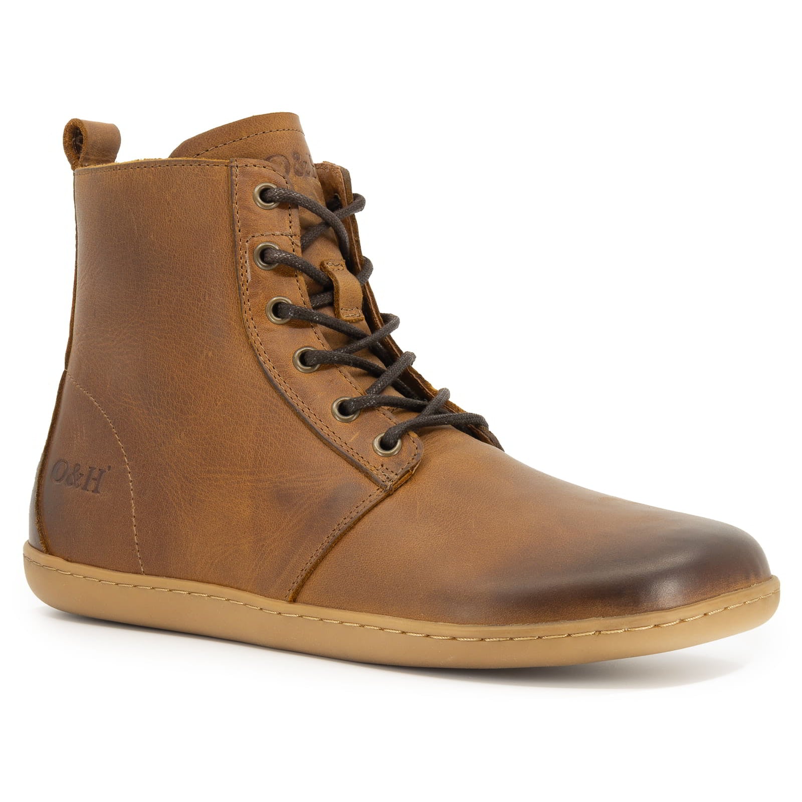 angled image of cherry barefoot boots in tan showing front lace and toe