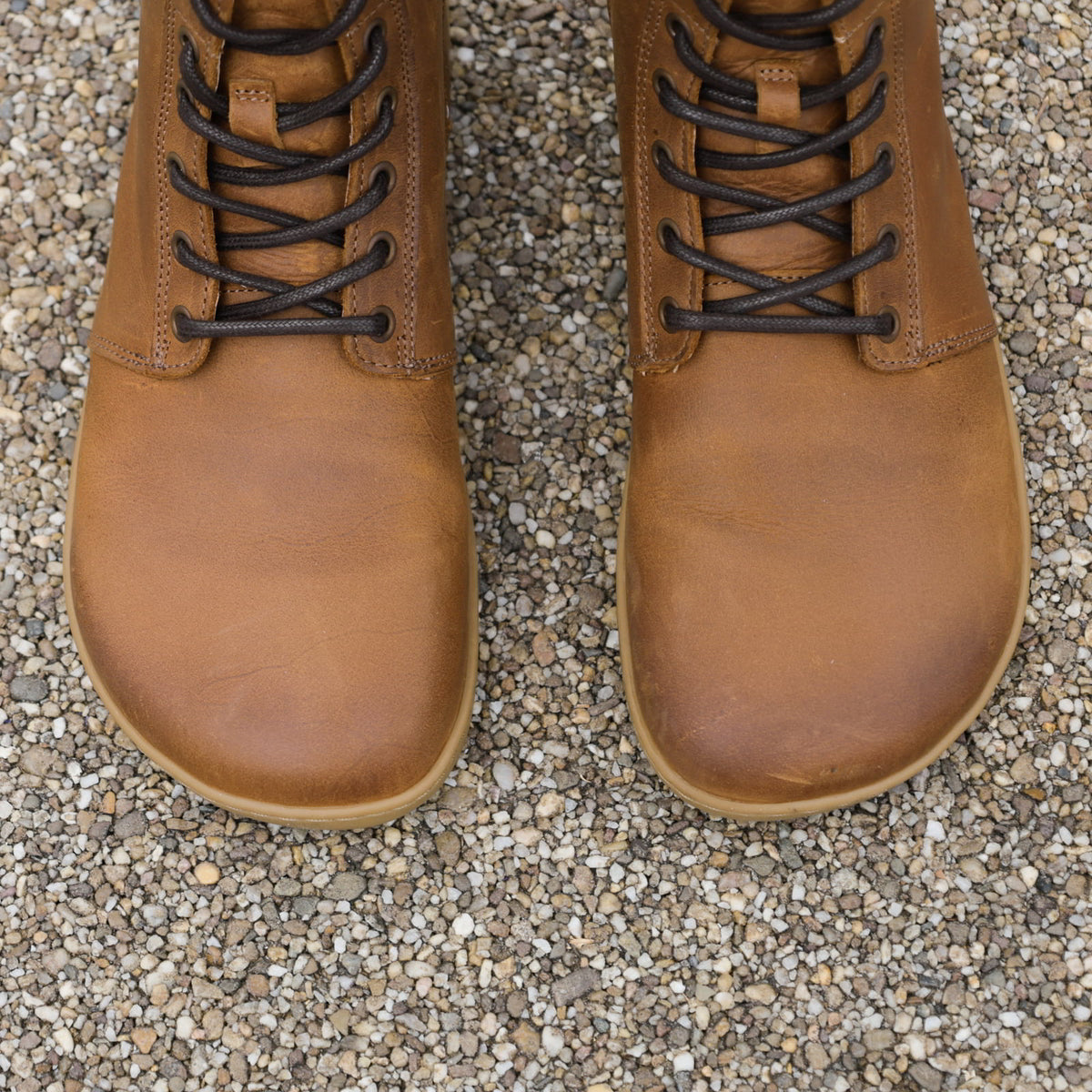 top down view of cherry barefoot boots in cognac showing the toe shape