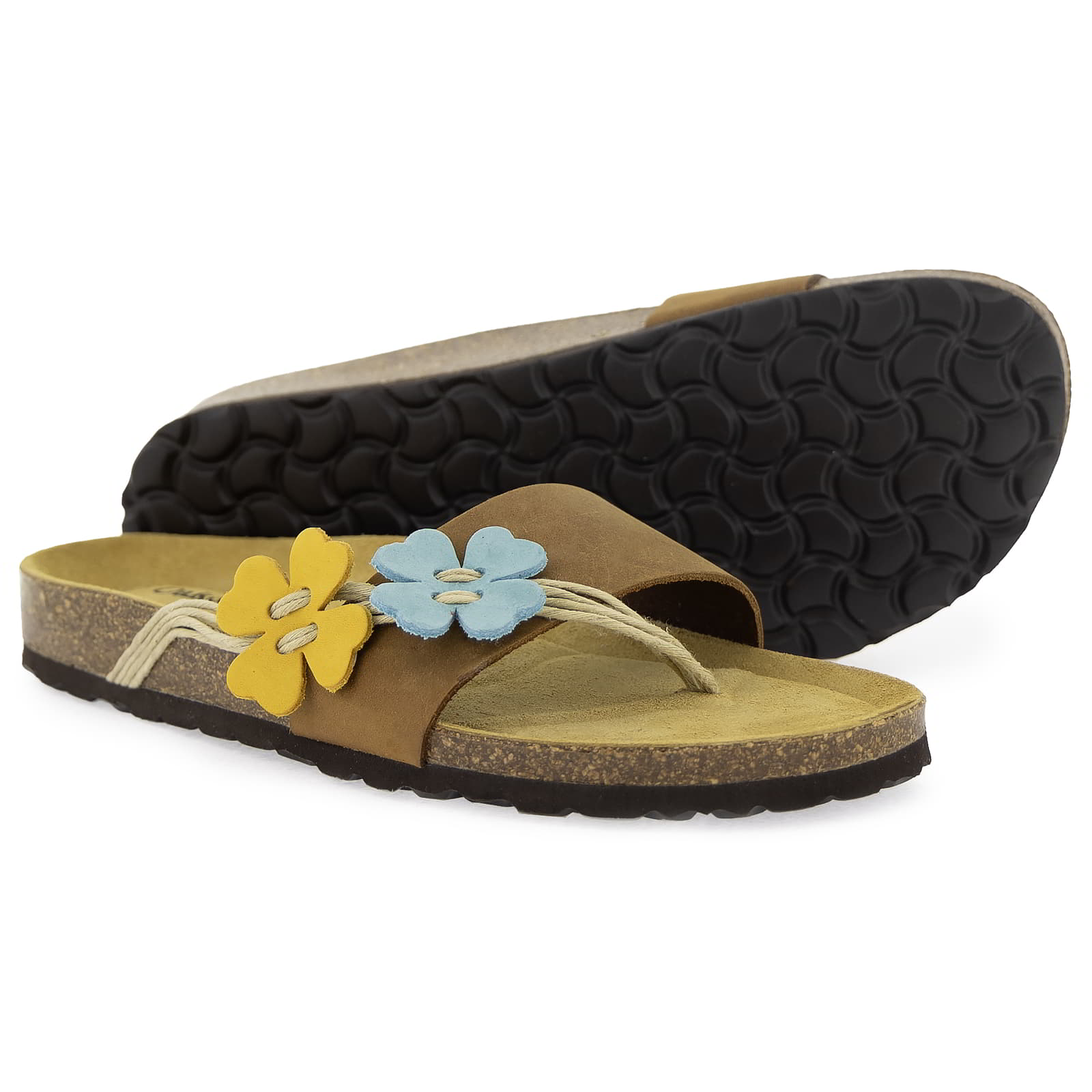 Outsole view of Clover tan sandal showing textured sole pattern