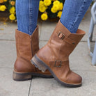 Cognac Crest Demi 2 ankle boots worn with jeans pivot on tip-toe