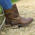 Dark brown Crest Demi 2 ankle boots worn outdoors stepping on gravel