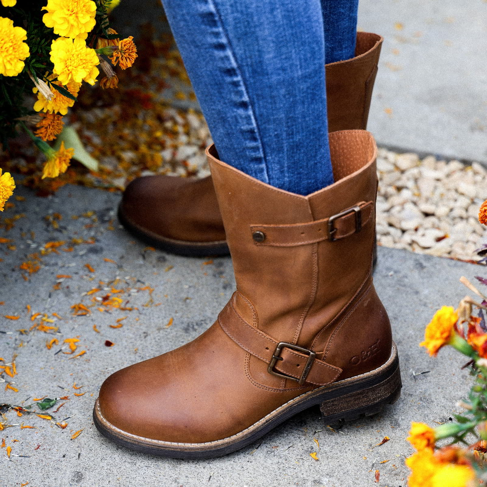 Cognac Crest Demi 2 ankle boots worn outdoors, close view of buckle and leather