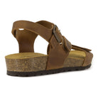 angled view of tan oak & hyde daisy sandals highlighting leather upper and cork midsole