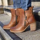 model standing on steps wearing Eastside 2 western boots with blue jeans