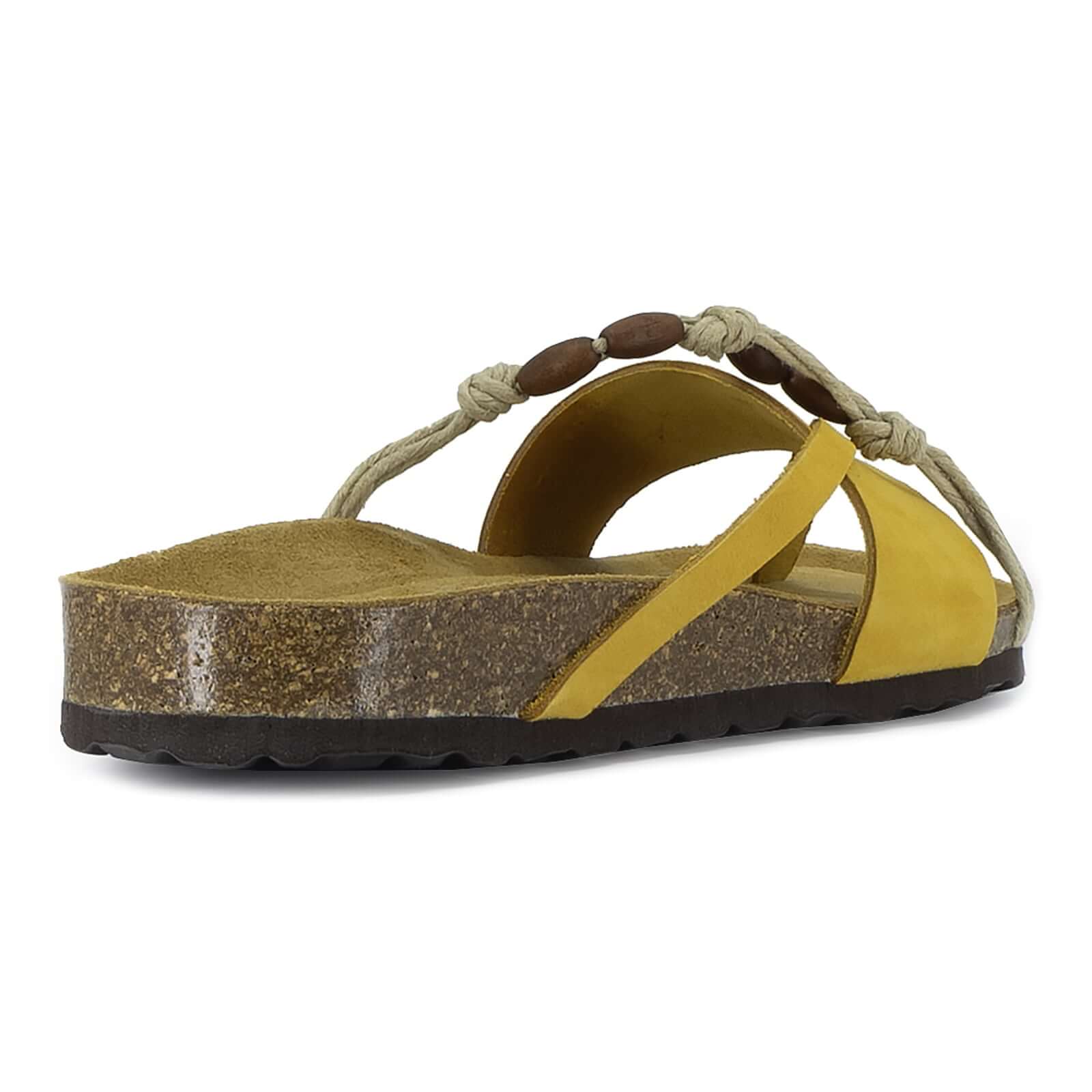 rear angle view of lemon oak & hyde ebony sandals showing heel edge and cork sole