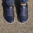 top down view of hazel barefoot trainers in navy on model showing toe shape
