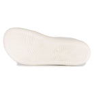 zero drop outsole of white barefoot trainers showing tread on white background