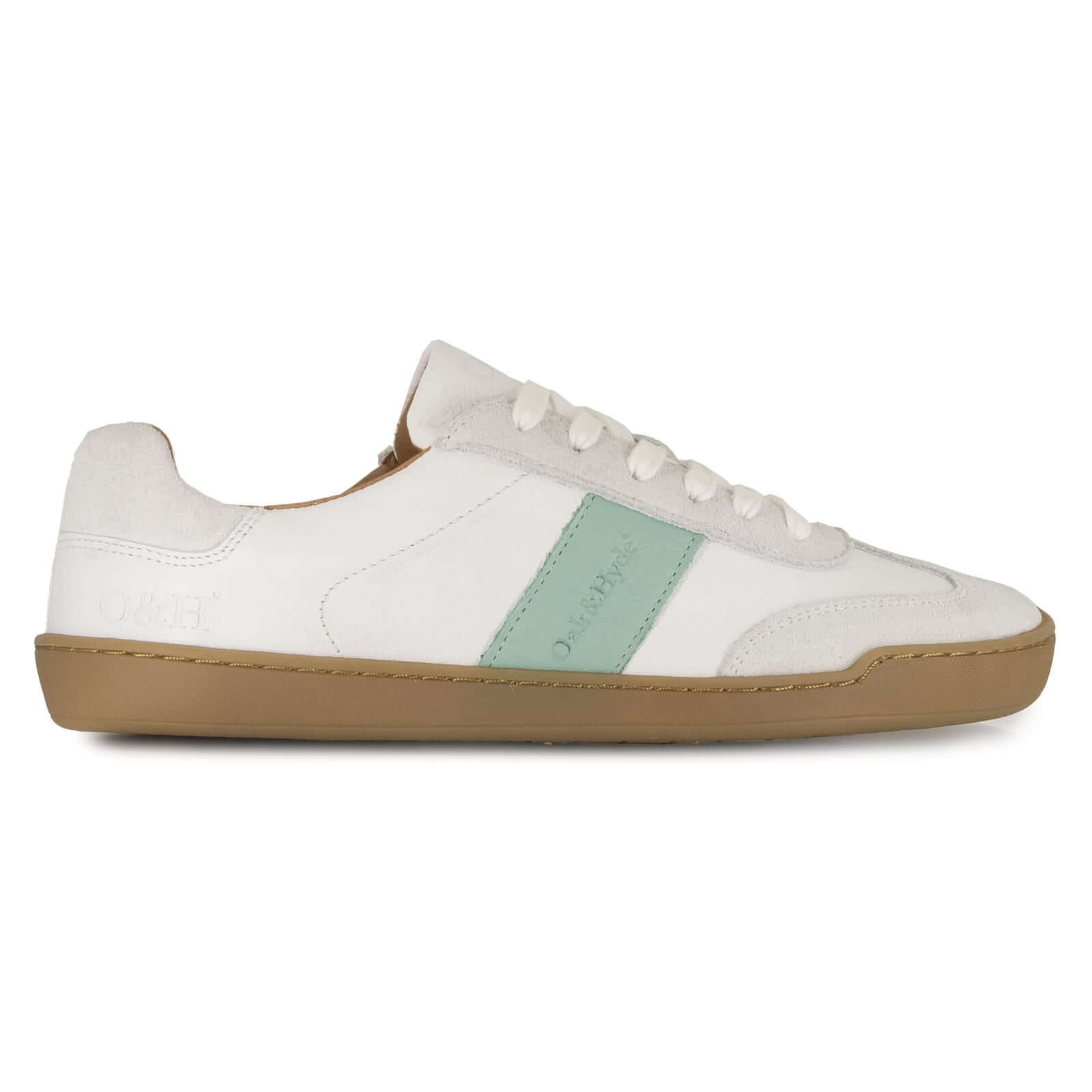 White barefoot trainer with a green accent on a white background