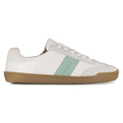 White barefoot trainer with a green accent on a white background