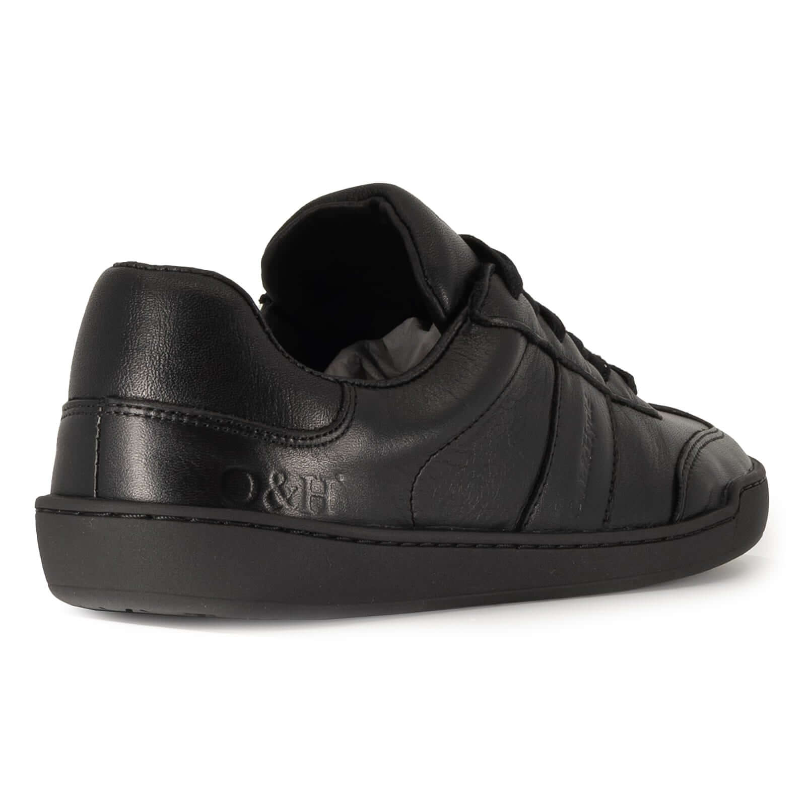 black leather barefoot shoe showing O&H logo on heel on white background