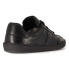 black leather barefoot shoe showing O&H logo on heel on white background