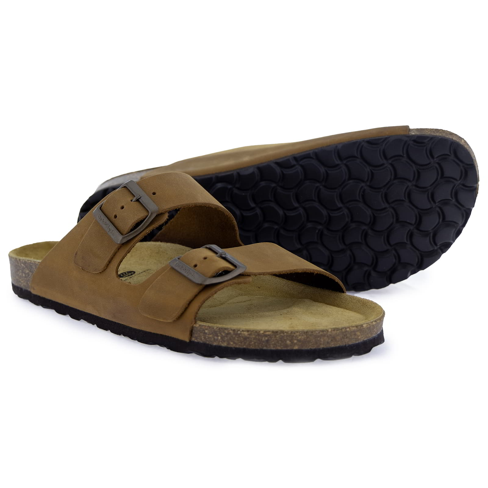 Pair of tan leather fisherman sandals, one showing the patterned black rubber sole and cork footbed