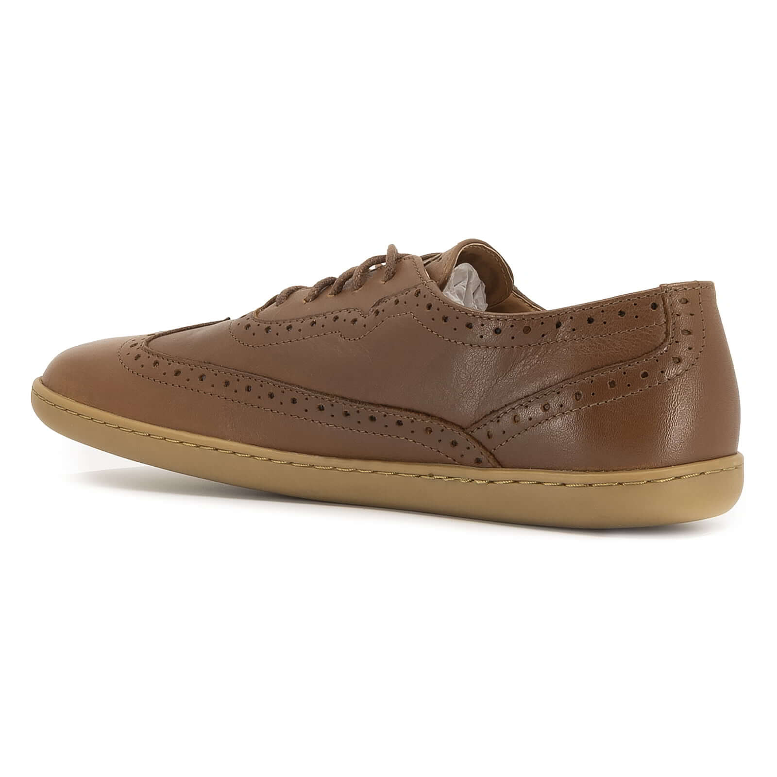 inside angled view of maple brogue barefoot shoes in tan showing brogue pattern detail