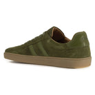 Inside angled view of mens Larch barefoot trainers in green showing logo on heel