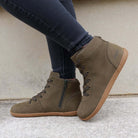 model wearing mulberry barefoot boots in khaki standing outdoors on a pavement