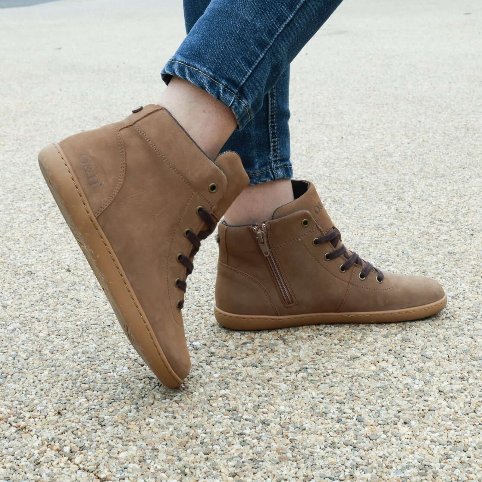 model wearing mulberry light brown barefoot ankle boots with blue jeans outside