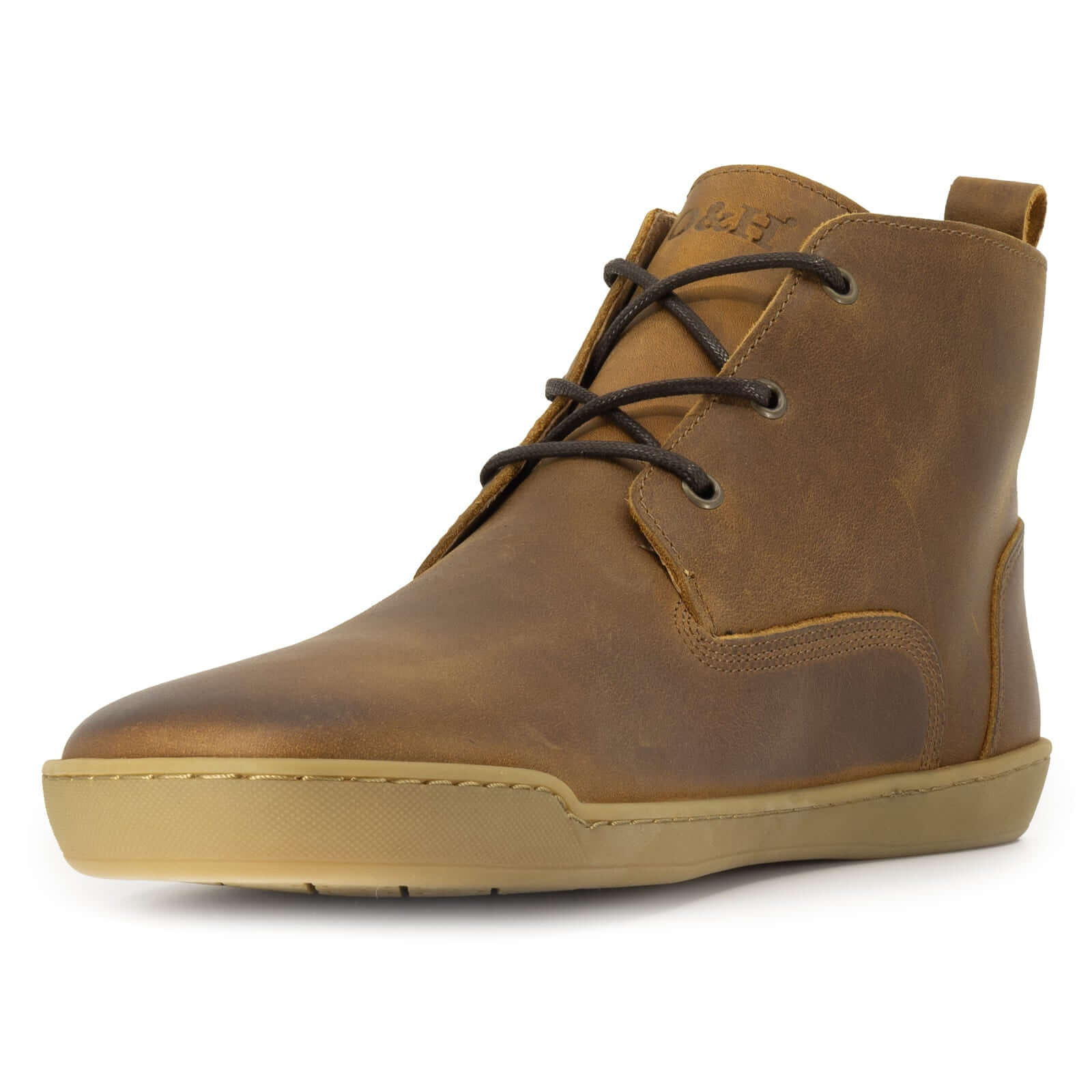 front angle view of spruce barefoot boots showing branding on tongue 