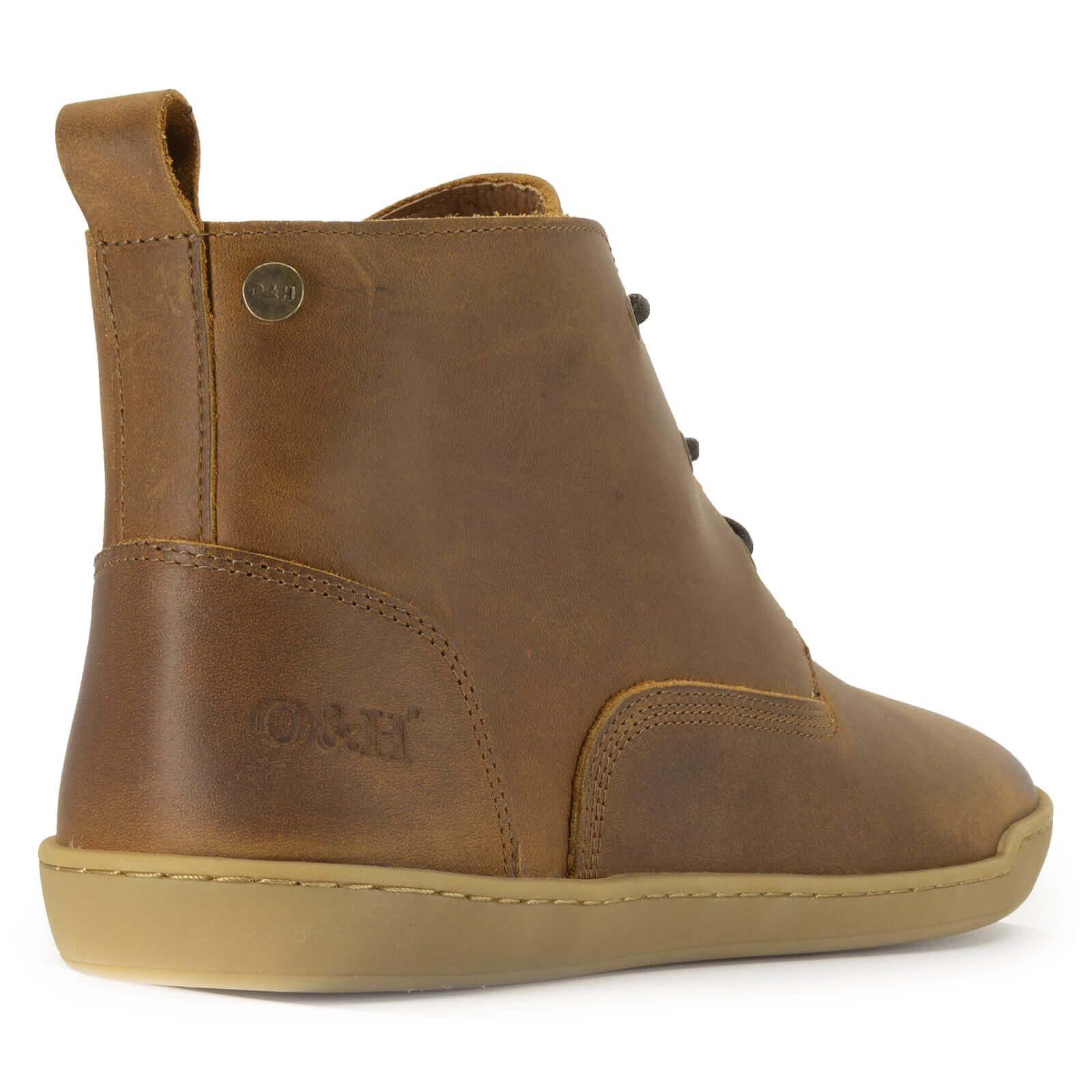 view of heel of spruce barefoot boots in tan highlighting heel pull loop