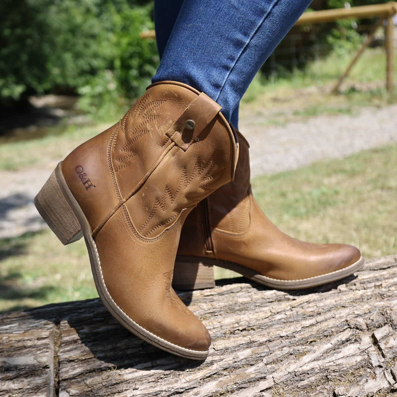 lifestyle image of model wearing the Texan Ankle boot in tan