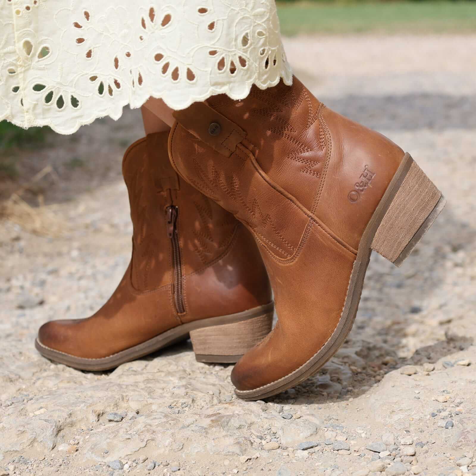 second lifestyle image of model wearing the Texan Ankle boot in tan
