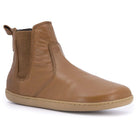 angled image of tan barefoot boots with gum outsole