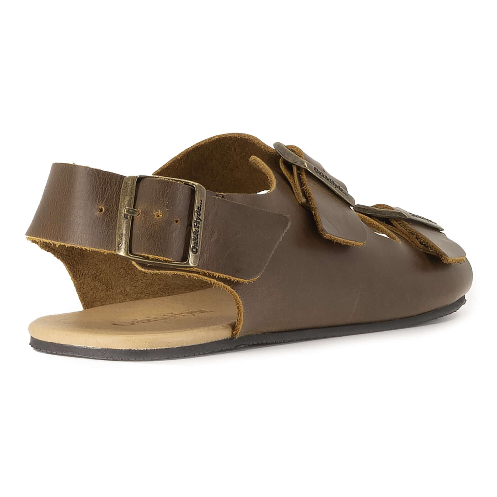rear angle view of brown oak & hyde wisteria barefoot sandals showing heel strap and natural footbed shape