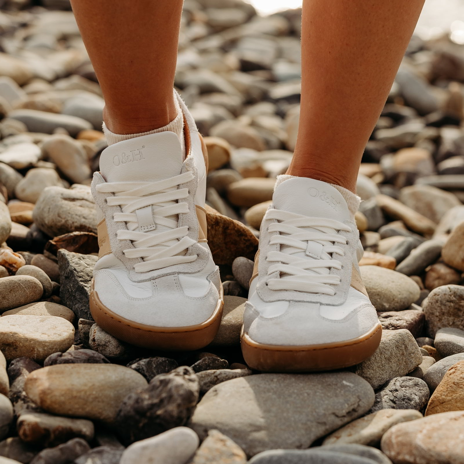 front view of juniper barefoot trainers in white being being worn by model