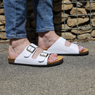 white oak & hyde malaga adjustable sandals worn outdoors with rolled jeans on pavement