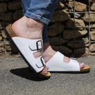 white oak & hyde malaga adjustable sandals worn outdoors showing adjustable buckles and cork footbed